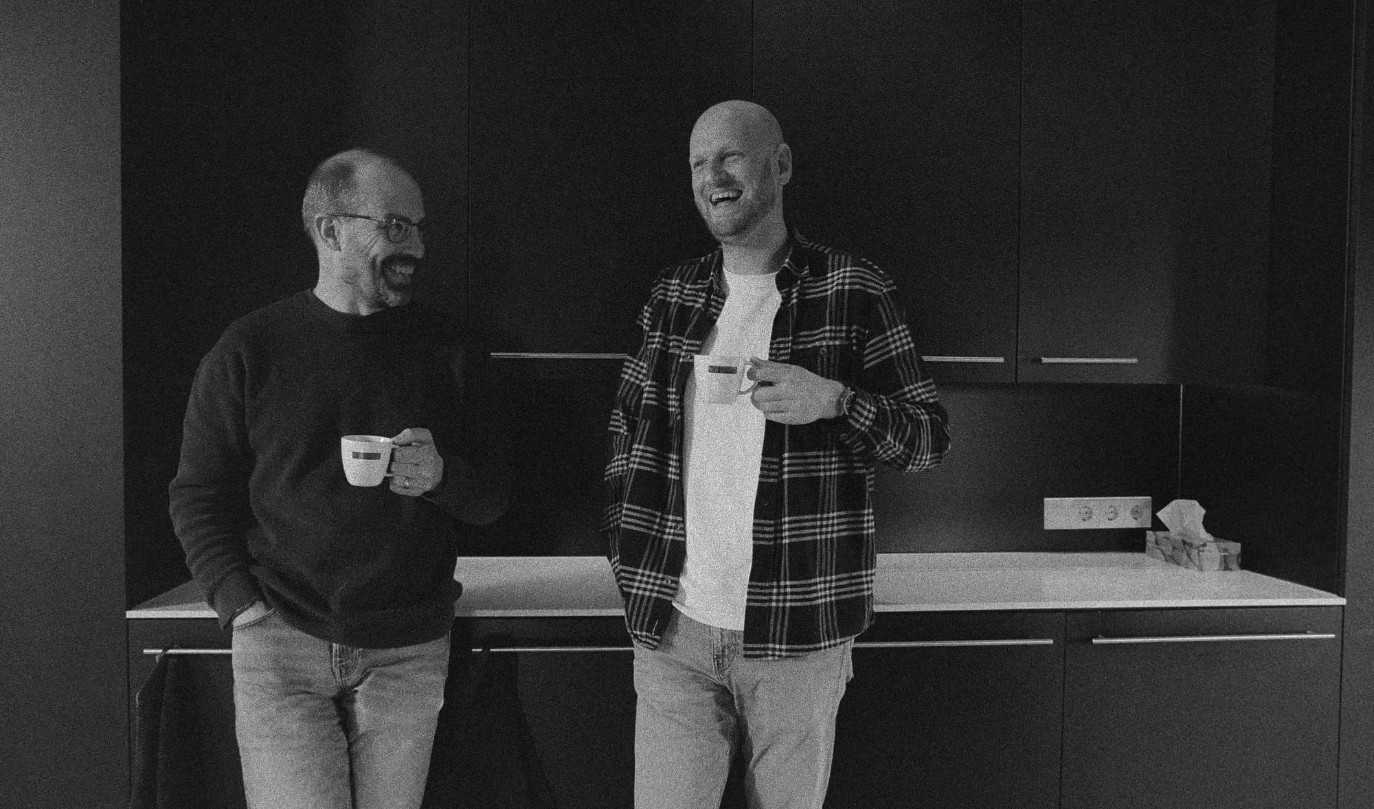 Colleagues smiling during coffee break